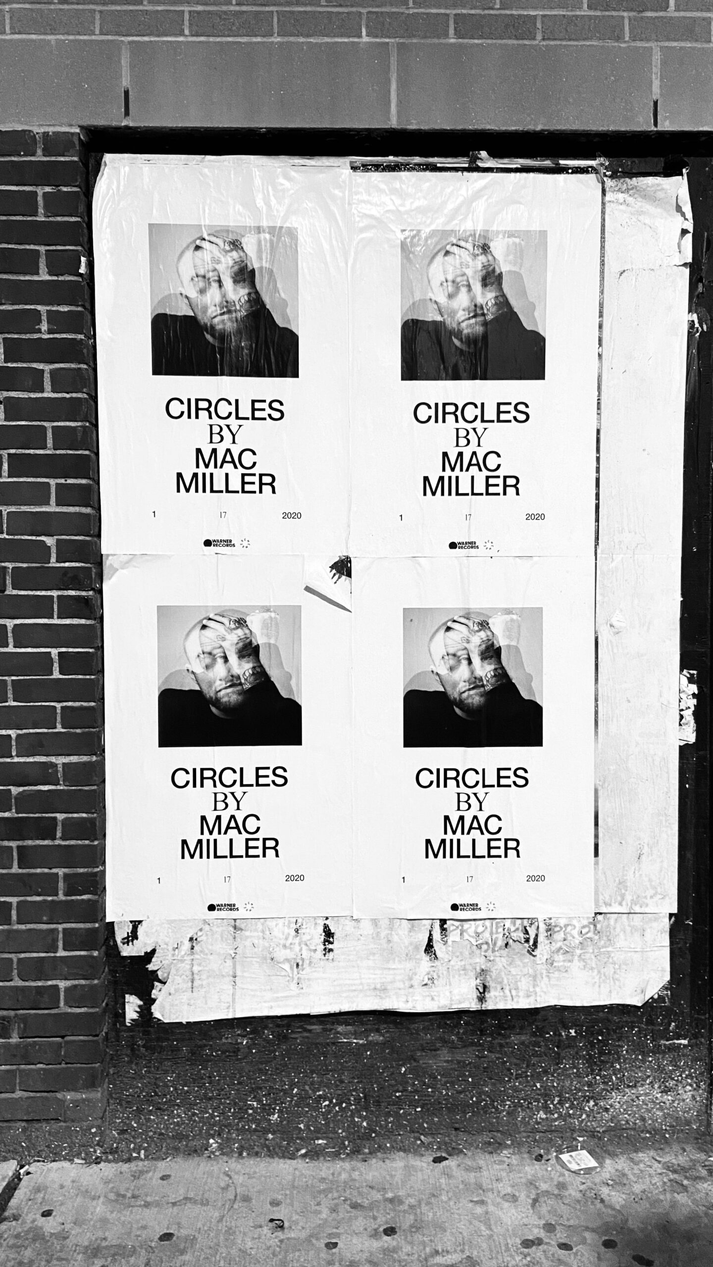 Posters one the street about Mac Miller