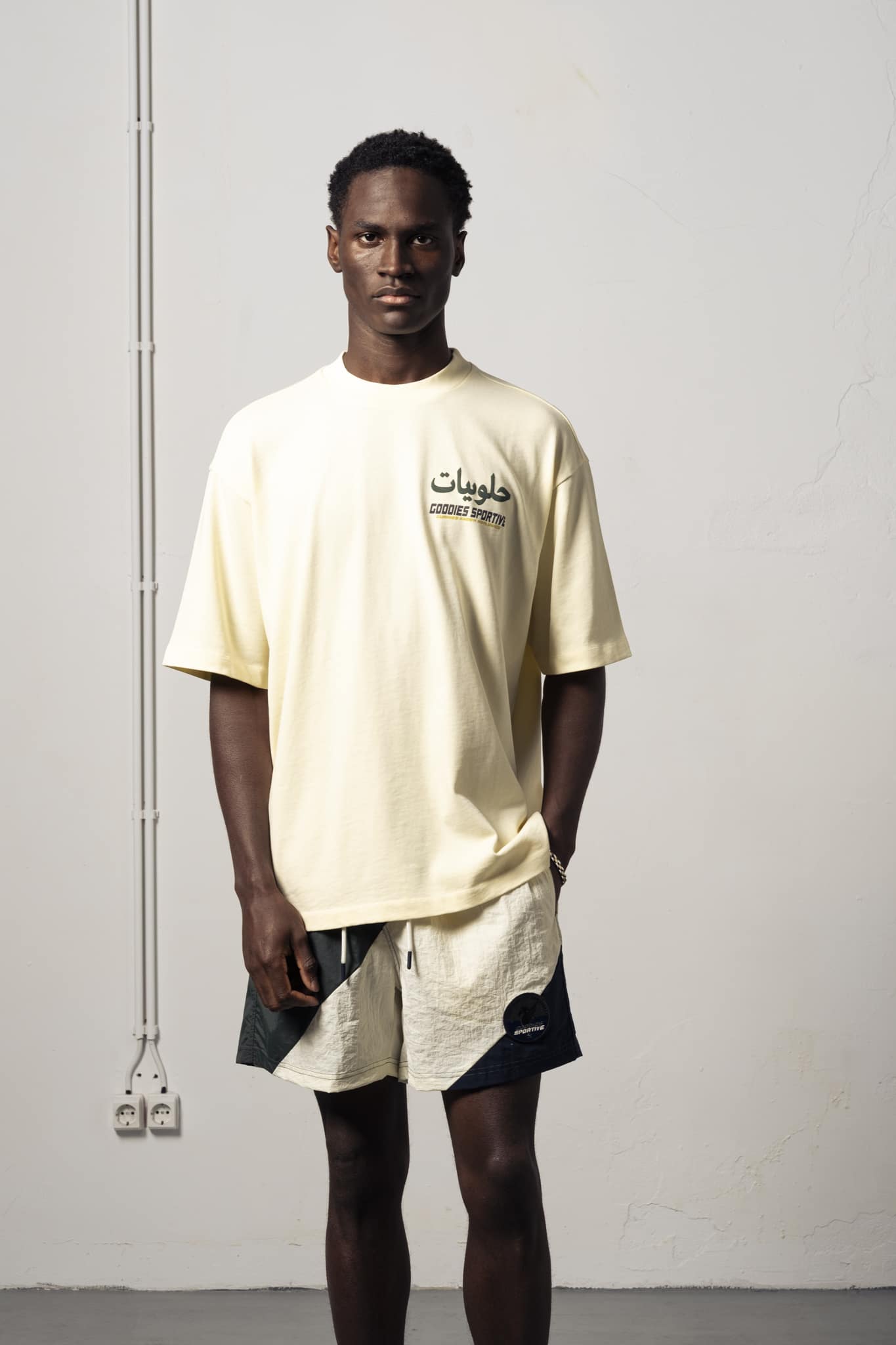 2-GKT26 a model with a Gummies Known Tee of Goodies-Sportive