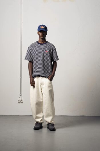 a model with a Legion Striped Tee of Goodies-Sportive