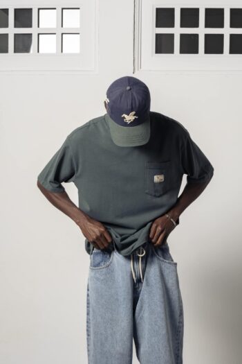 a model with a Premium Washed Cobalt Tee Tee of Goodies-Sportive