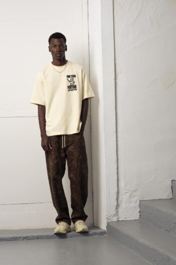 A model with Fortune Butter Tee by Goodies Sportive