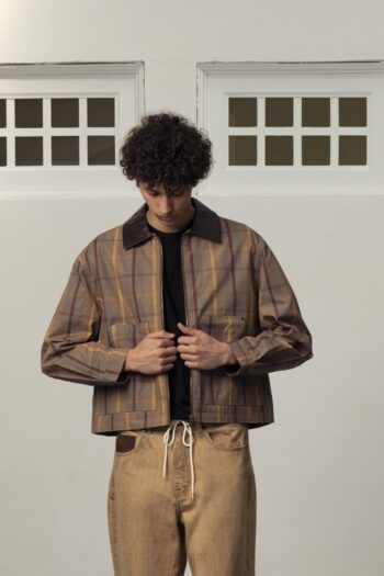 A model with Wax Effect Jacket by Goodies Sportive