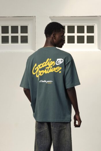 A model with The Pegasus Green Tee by Goodies Sportive