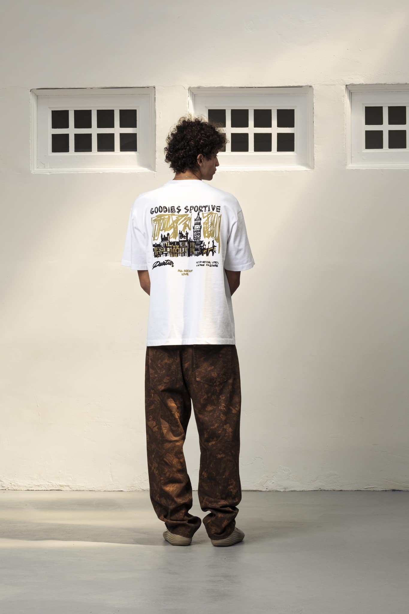 38-LONDON WHITE TEE � LWT26-004 A model with London White Tee by Goodies Sportive