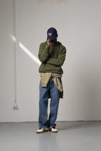 A model with Winter Moss Knit Hoodie by Goodies Sportive